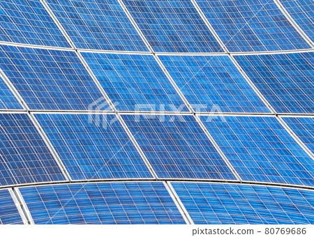Electric Solar panels with a blue sky reflection. Concept of green energy Electric Solar panels with a blue sky reflection. Concept of green energy 80769686