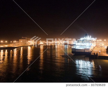 Shining ferry boat in midnight port is loaded and boat is ready to leaves Shining ferry boat in midnight port is loaded and boat is ready to leaves 80769689