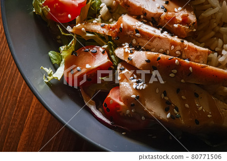 Curry chicken bewast with vegetables and sesame seeds on top, extreme closeup shot 80771506