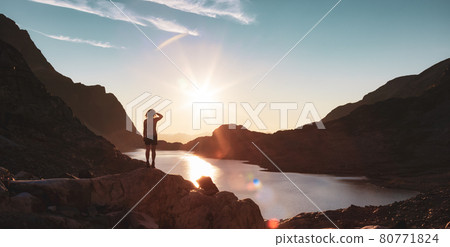 Adventurous Caucasian Adult Woman Hiking on top of a Canadian Rocky Mountain Adventurous Caucasian Adult Woman Hiking on top of a Canadian Rocky Mountain 80771824
