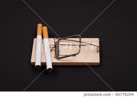 Tobacco Addiction - Cigarettes in Wooden Mousetrap 80776204