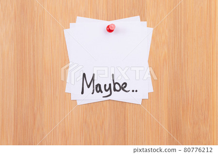 MAYBE.. - White Sticky Notes with Written Word MAYBE, Pinned to the Wooden Message Board MAYBE.. - White Sticky Notes with Written Word MAYBE, Pinned to the Wooden Message Board 80776212