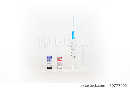 The coronavirus vaccine is in the hands of a doctor, a syringe 80777493