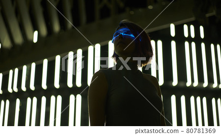 Cyberpunk style portrait of beautiful young woman in futuristic costume. Cyberpunk style portrait of beautiful young woman in futuristic costume. 80781369