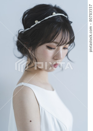 Bride wearing a wedding dress Bride wearing a wedding dress 80783557