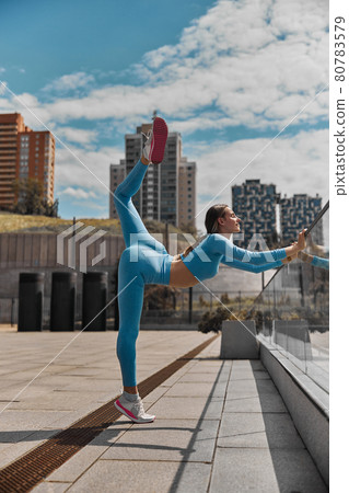 Beautiful fit young woman jogger is running outdoors 80783579