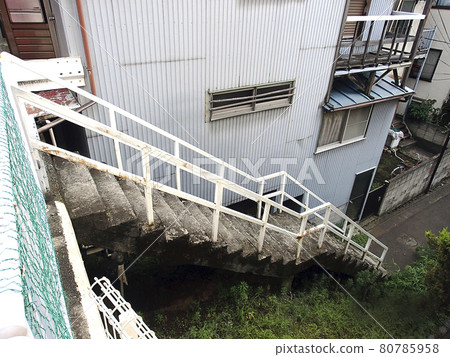 Steep narrow stairs in a residential area 80785958