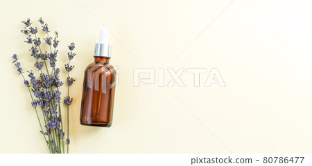 Dropper glass serum bottle of lavender oil top view 80786477