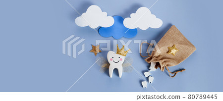National Tooth Fairy Day. Children tooth fairy. Cute tooth with wings, a crown and a magic wand and bag with teeth. National Tooth Fairy Day. Children tooth fairy. Cute tooth with wings, a crown and a magic wand and bag with teeth. 80789445
