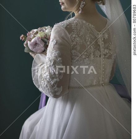 woman with bridal bouquet. eremony wedding day. hands with wedding rings. woman with bridal bouquet. eremony wedding day. hands with wedding rings. 80789683