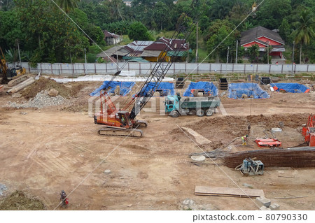 MALACCA, MALAYSIA -AUGUST 24, 2016: Construction site in progress at Malacca, Malaysia during daytime. Daily activity is ongoing. MALACCA, MALAYSIA -AUGUST 24, 2016: Construction site in progress at Malacca, Malaysia during daytime. Daily activity is ongoing. 80790330