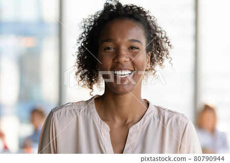 Joyful young african businesswoman looking at camera. 80790944