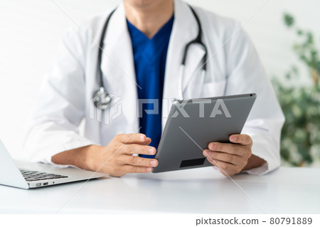 Doctor middle man white coat scrub medical examination at hand 80791889