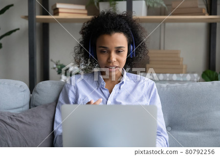 African American woman in headphones have webcam call 80792256