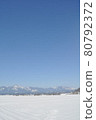 Contrast between snow and blue sky 80792372