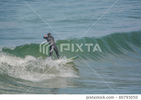 Surfing on the Pacific Ocean at Pismo State Beach in San Luis obispo County, California Surfing on the Pacific Ocean at Pismo State Beach in San Luis obispo County, California 80793050
