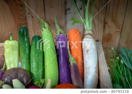 Assorted vegetables, spices and mushrooms are prepared for cooking. 80793158