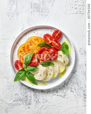 plate of tomato and mozzarella salad plate of tomato and mozzarella salad 80794300