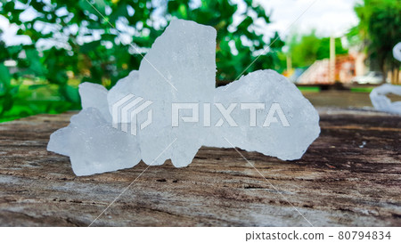 Alum on wood plank. Concept for body deodourant and vegetable preservation 80794834
