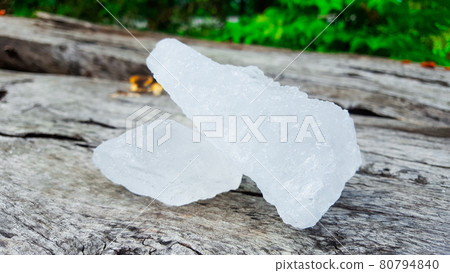Alum on wood plank. Concept for body deodourant and vegetable preservation Alum on wood plank. Concept for body deodourant and vegetable preservation 80794840