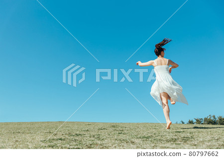 A dancing woman in the sky and a white one-piece A dancing woman in the sky and a white one-piece 80797662