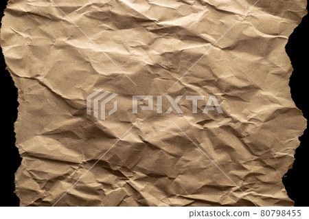 Torn craft paper. Old craft vintage cardboard isolated on black. Torn kraft paper texture background. Recycled material concept. 80798455