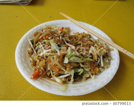 Pad Thai, Thai style fried noodles to eat at a stall in a tourist destination in Thailand Pad Thai, Thai style fried noodles to eat at a stall in a tourist destination in Thailand 80799013