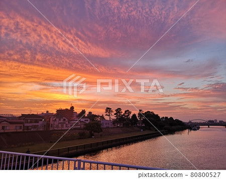 Beautiful riverside scenery with a sunset sky Beautiful riverside scenery with a sunset sky 80800527