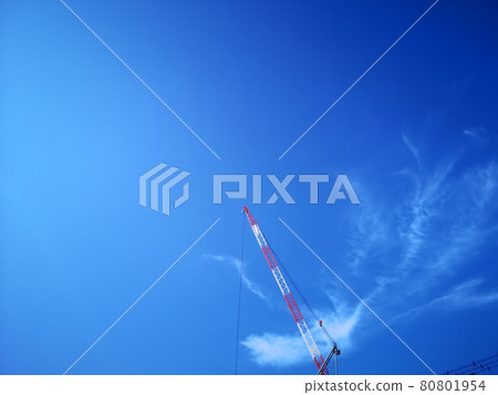 Towering crane and blue sky Towering crane and blue sky 80801954