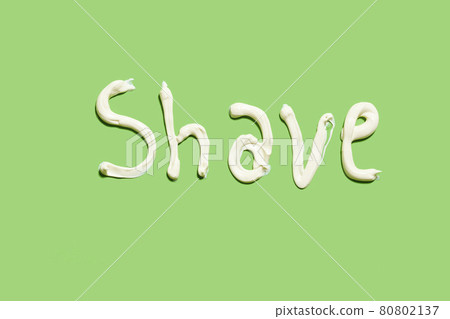 Shave word written with shaving cream on the green background Shave word written with shaving cream on the green background 80802137