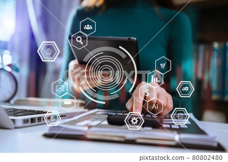 Businesswoman hand working digital marketing media in virtual screen with mobile phone and modern compute with VR icon diagram at office Businesswoman hand working digital marketing media in virtual screen with mobile phone and modern compute with VR icon diagram at office 80802480