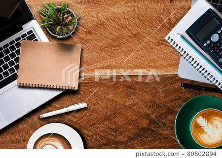 Workplace in office with wooden desk. Top view from above of  equipment placed and coffee. Space for modern creative work of designer. 80802894