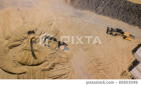 Top view of excavator working in construction site. 80803099