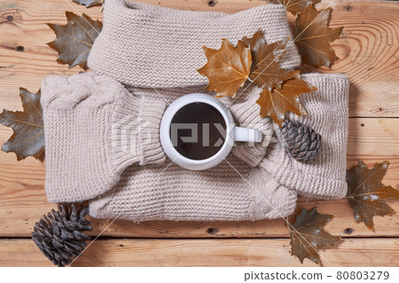 A cozy autumn day. Cold autumn morning with cup of coffee. Fall autumn weekend, leisure, mental day off, relaxing at home A cozy autumn day. Cold autumn morning with cup of coffee. Fall autumn weekend, leisure, mental day off, relaxing at home 80803279