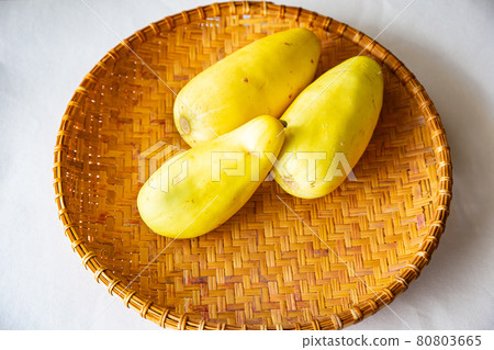 Freshly picked banana melon on a colander harvested in the vegetable garden 80803665