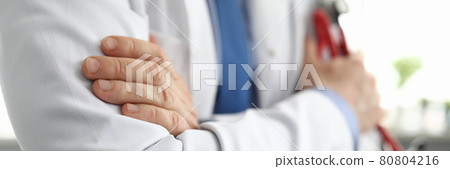 Hands of doctor in white coat holding stethoscope 80804216