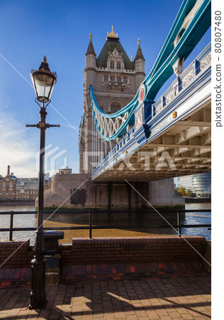 London cityscape with Tower Bridge over the River Thames and lamppost 80807480