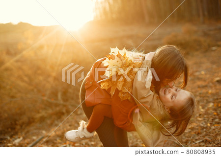 Cute and stylish family in a autumn park Cute and stylish family in a autumn park 80808935