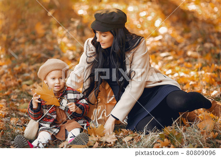 Cute and stylish family in a autumn park 80809096