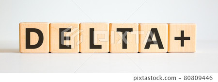 Covid-19 delta plus variant symbol. Wooden cubes with words Delta plus. Beautiful white background. Copy space. COVID-19 new delta plus variant concept. 80809446