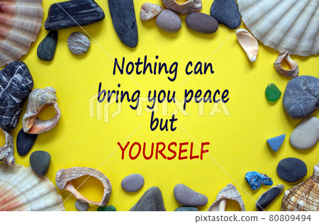 The development of the imagination. Words 'nothing can bring you peace but yourself' on a beautiful yellow background. Sea stones and seashells. Inspirational and motivational concept. 80809494