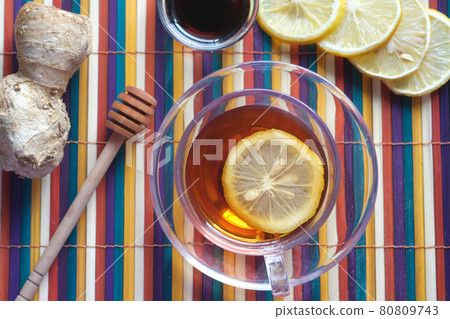 Top view of ginger tea on wooden background. Top view of ginger tea on wooden background. 80809743