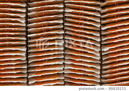 Top view, tea bags neatly arranged to rows in box. 80810131