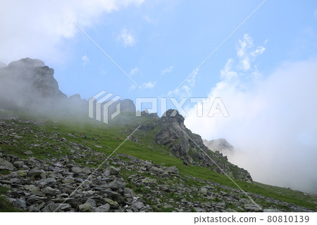 Schwarze Hoerner, mountain peaks in the Pizol region on a misty summer morning. 80810139