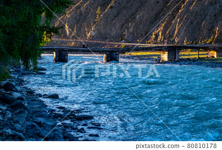 Wooden bridge over the Chuya river in the Altai Republic Wooden bridge over the Chuya river in the Altai Republic 80810178