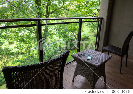 Balcony and garden furniture facing the forest Smartphone and glasses 80813036