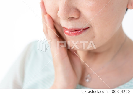 Beauty image of a woman touching her cheeks Beauty image of a woman touching her cheeks 80814200