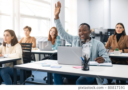 Portrait of black guy student raising hand at classroom 80817191