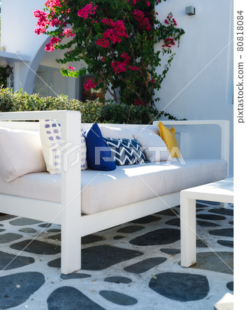 A cozy place to relax. Cushions on the couch in an outdoor cafe. Traditional Greek design. 80818084