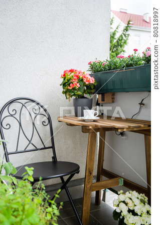 Cosy green balcony on summer time Cosy green balcony on summer time 80818997